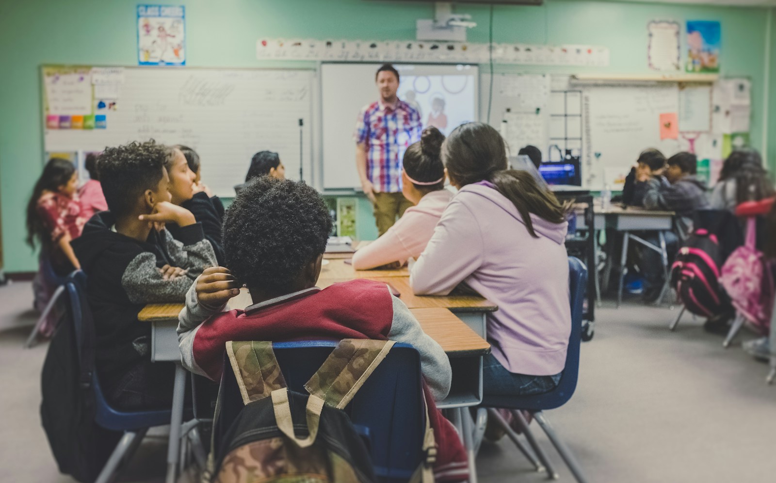 A teacher with students in a classroom